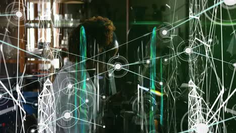 Animation-of-network-of-connections-over-african-american-female-scientist-working-in-lab