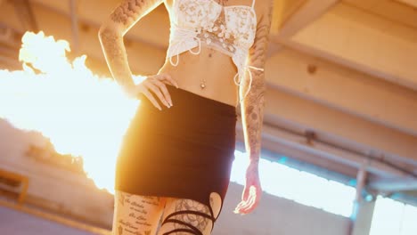 beautiful woman walking, flames, fireballs in the background