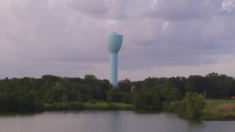 aerial footage of brays bayou with prominent blue water tower in houston