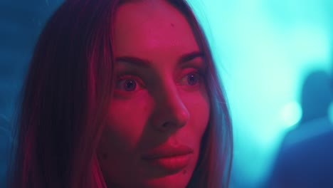 cinematic close up portrait of stylish woman in neon lighted interior, cinema effects in purple-blue