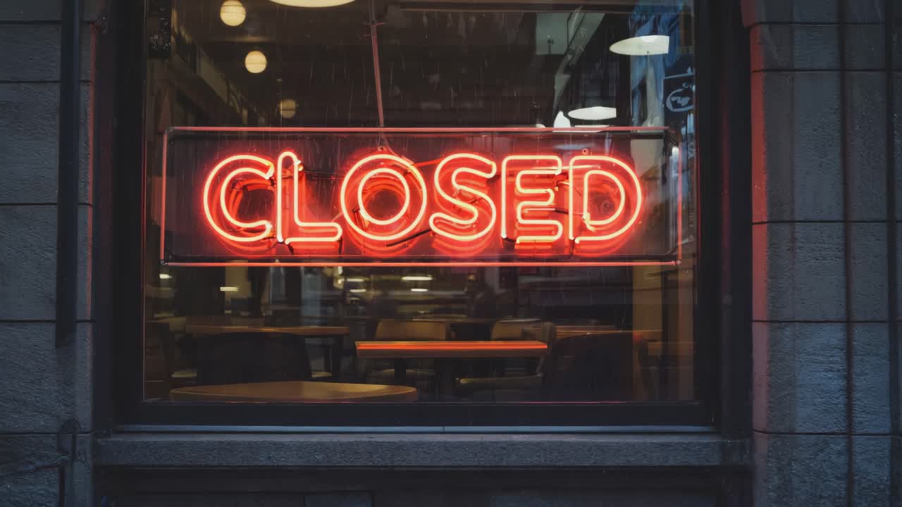 Closed neon sign in window