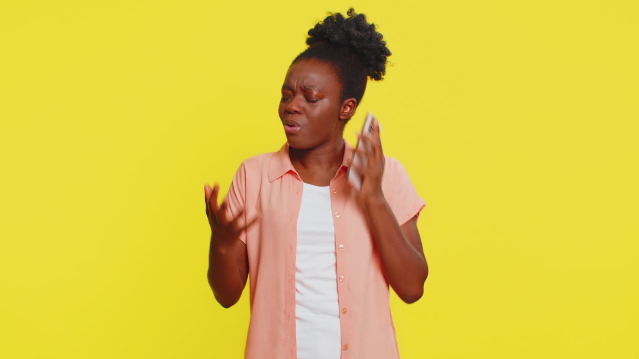 African american woman angry phone conversation irritated gestures frustrated expression tension