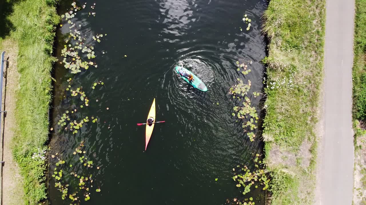 People playing some water game with a kajak and sub
