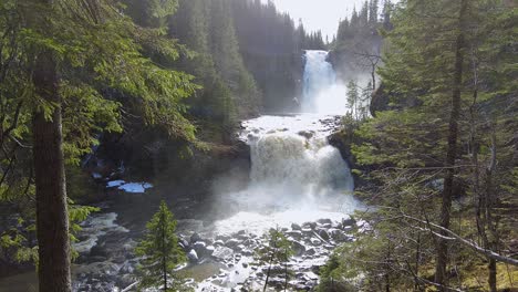 view towards the storfossen and metifossen waterfalls on river homla, trondheim area in norway