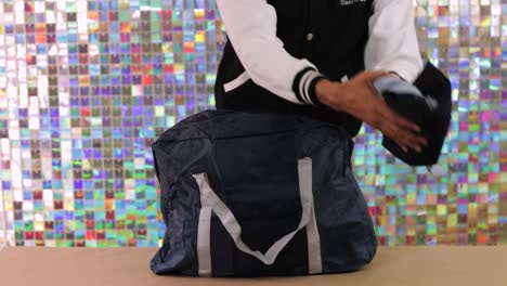 packing personal items into a travel bag, establisher