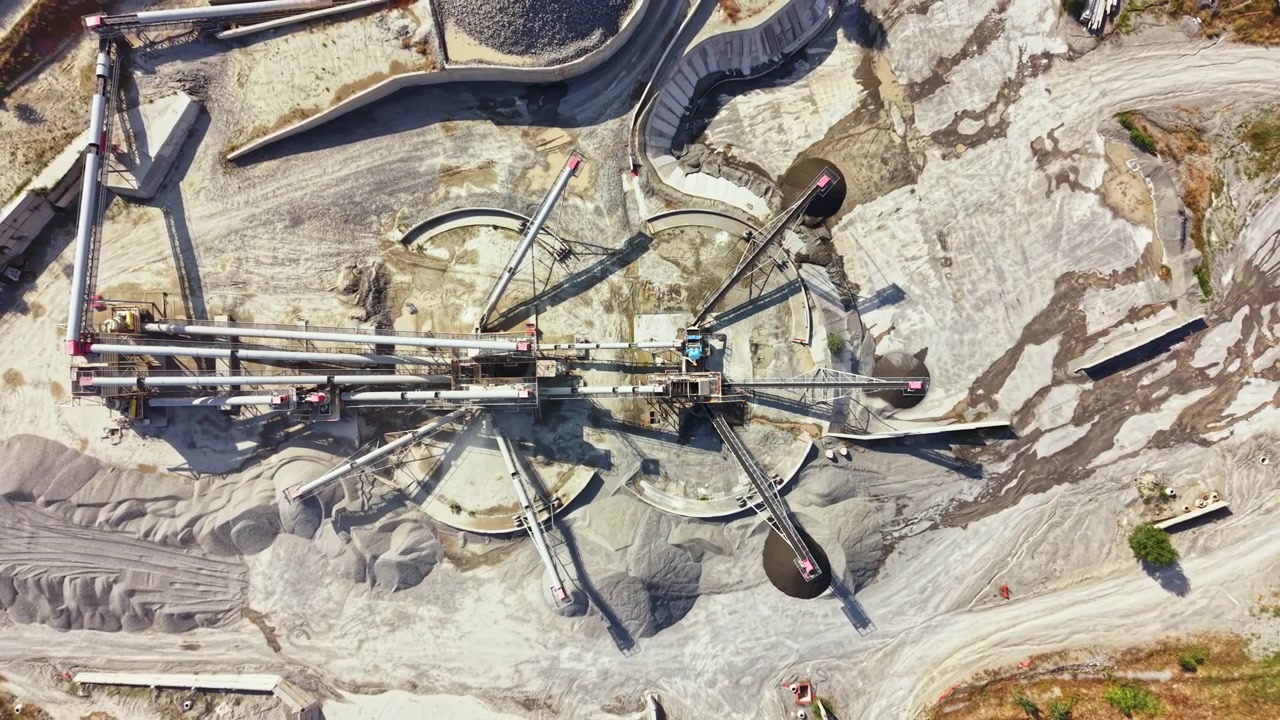 Granite quarry operation showing machinery and materials in a working site