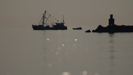 fishing boats at sunrise/sunset