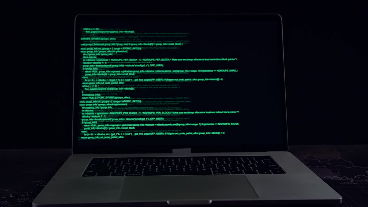 Code On A Laptop Computer Monitor In A Dark Room