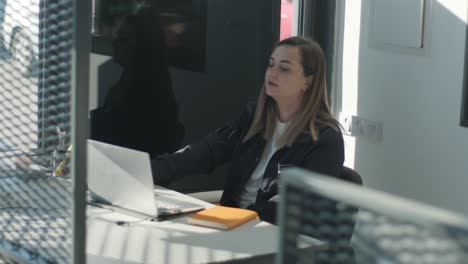 car service manager working at desk in office