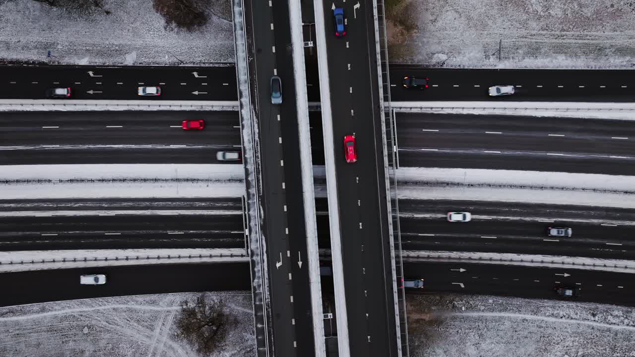 Top-down static drone shot of snow-covered highway interchange in winter, Latvia