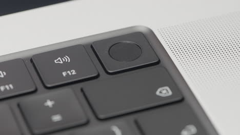 close-up of laptop keyboard with volume and touchpad buttons