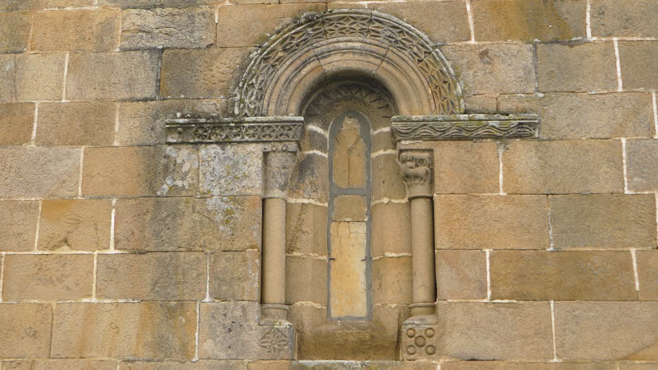 Ancient Stone Arch and Window Detail on a Building Wall