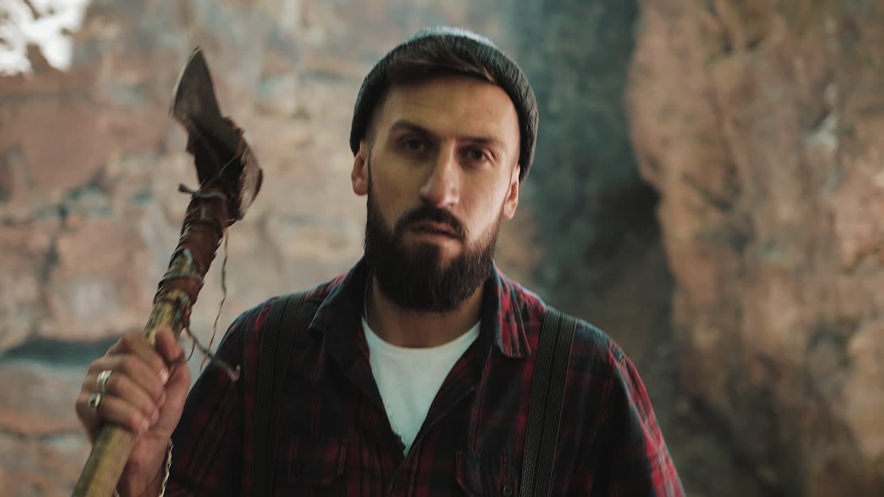 Man with axe in a cave