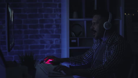 man gaming at night