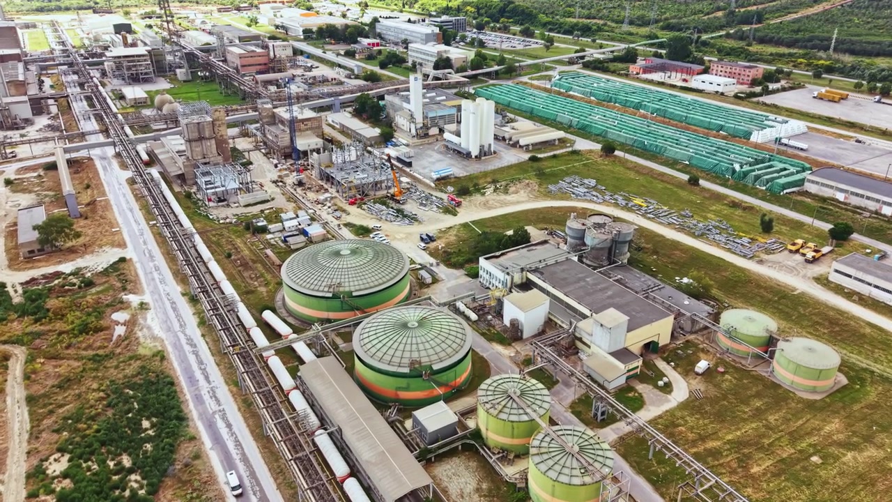 Industrial plant located in a rural area with large tanks and structures used for manufacturing and processing