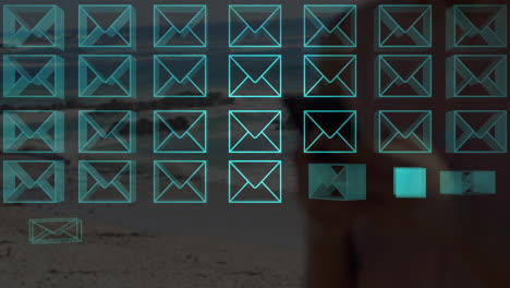 Animation of multiple neon message icons over mid section of woman using smartphone at the beach