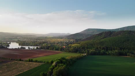 aerial view of rural country panorama with plantations and green hills in europe