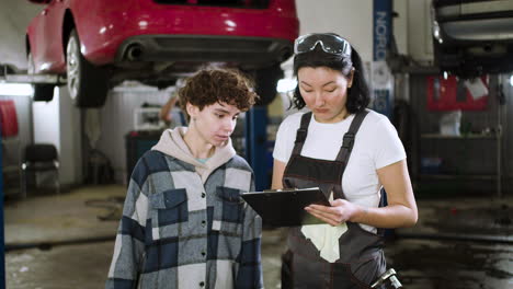 mechanic talking with client