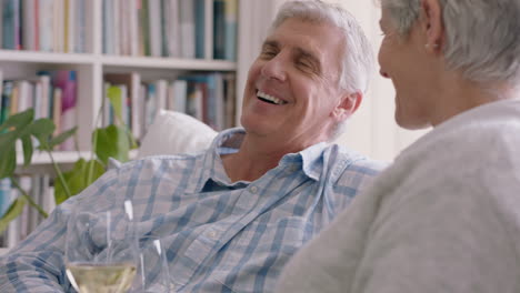 happy-old-couple-drinking-wine-relaxing-on-sofa-at-home-making-toast-celebrating-anniversary-enjoying-romantic-relationship-on-comfortable-retirement-4k-footage