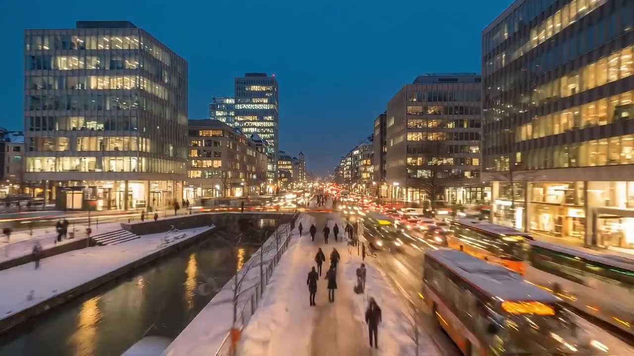 Urban Nightscape: A Lively Winter Evening Scene with People Walking Along Snowy Streets and Vibrant City Lights Reflecting on Wet Pavement