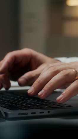 person typing on a laptop