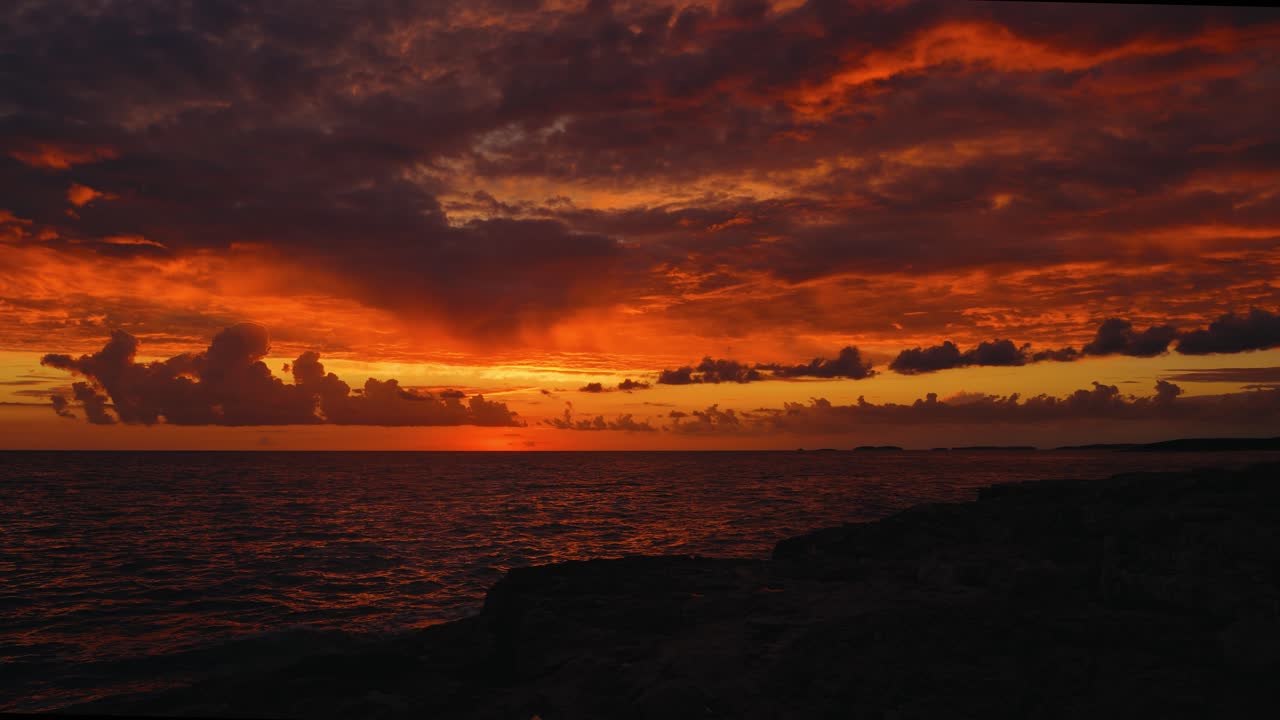 Colorful nature sunset sky over the Adriatic Sea in Istria, Croatia. Seaside waves moving gently