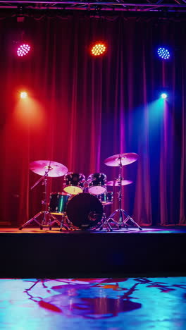 drums on stage with stage lighting