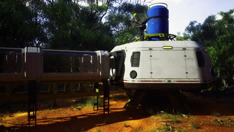futuristic spacecraft positioned in a lush green setting under bright sunlight