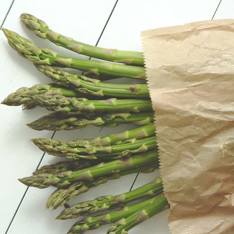 fresh green asparagus in a brown paper bag  healthy eating concept  food for vegetarians