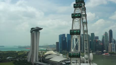 day time singapore famous flyer cabin close up downtown aerial panorama 4k