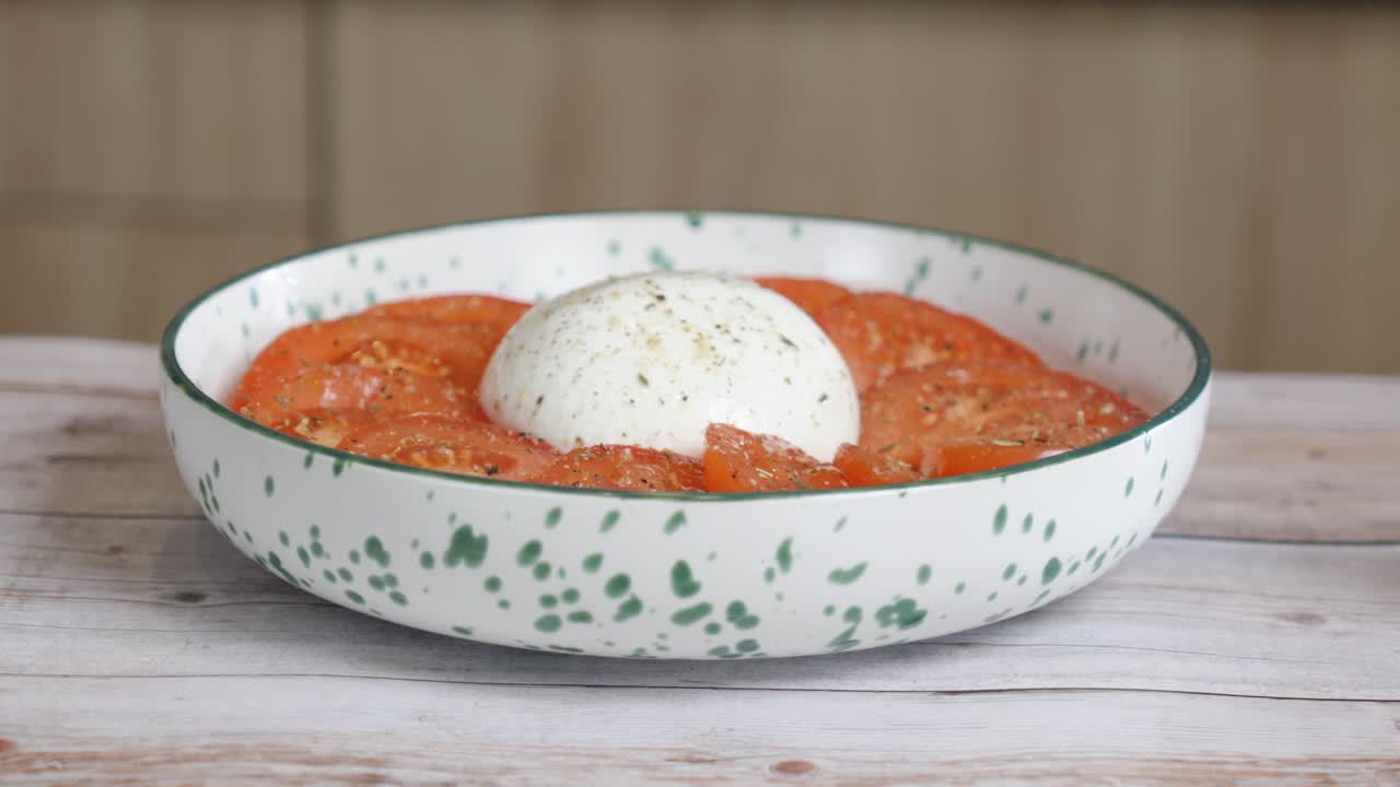 rising shot of a freshly prepared Burrata ready to be cooked