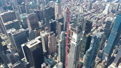 aerial of a thin skyscraper under construction on west 57th street in new york city new york