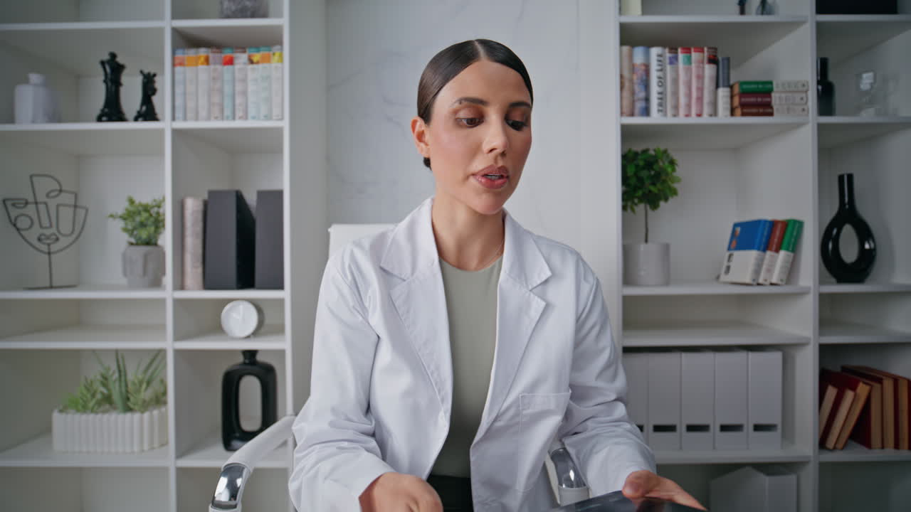 Medic consulting video meeting in medical clinic closeup. Doctor internet call