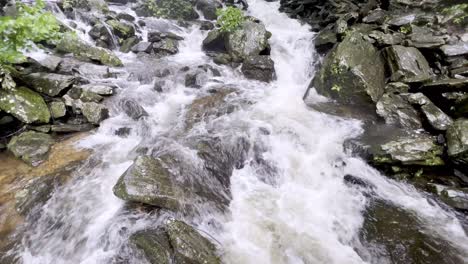 river flows at the base of crabtree falls in nc, north carolina