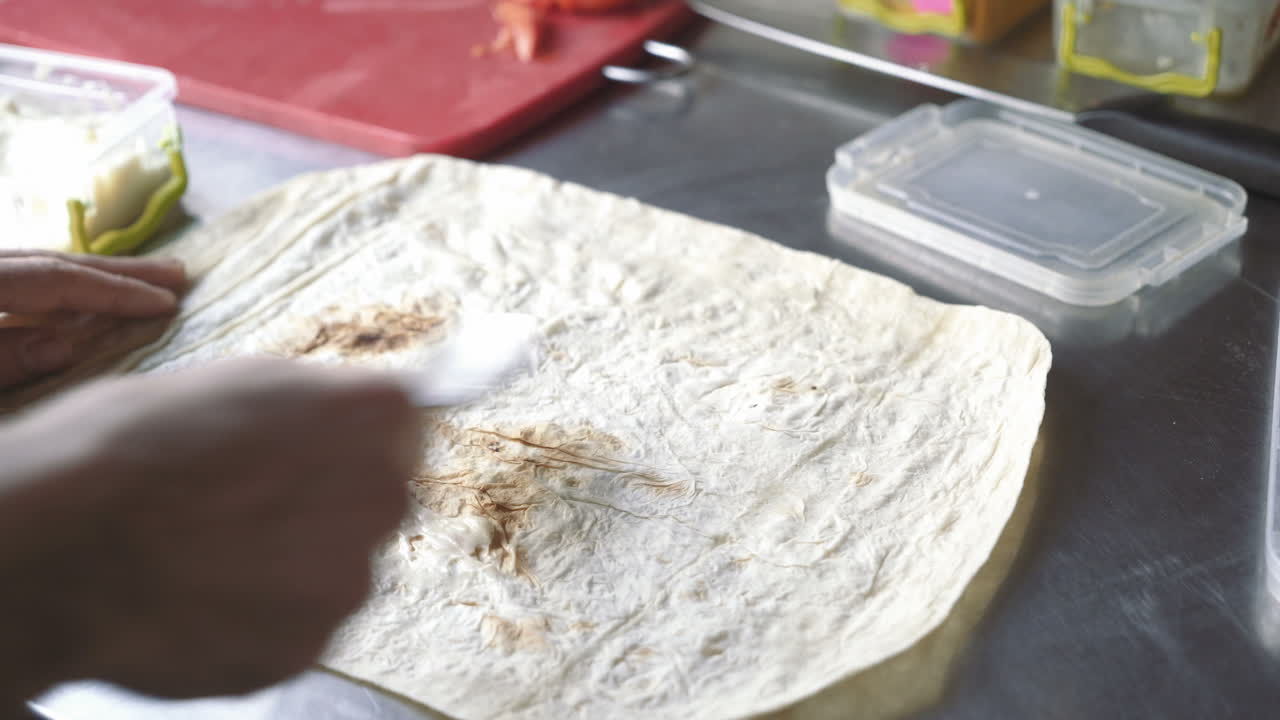Lavash rolls with cheese and tomatoes. Cooking Shawarma.