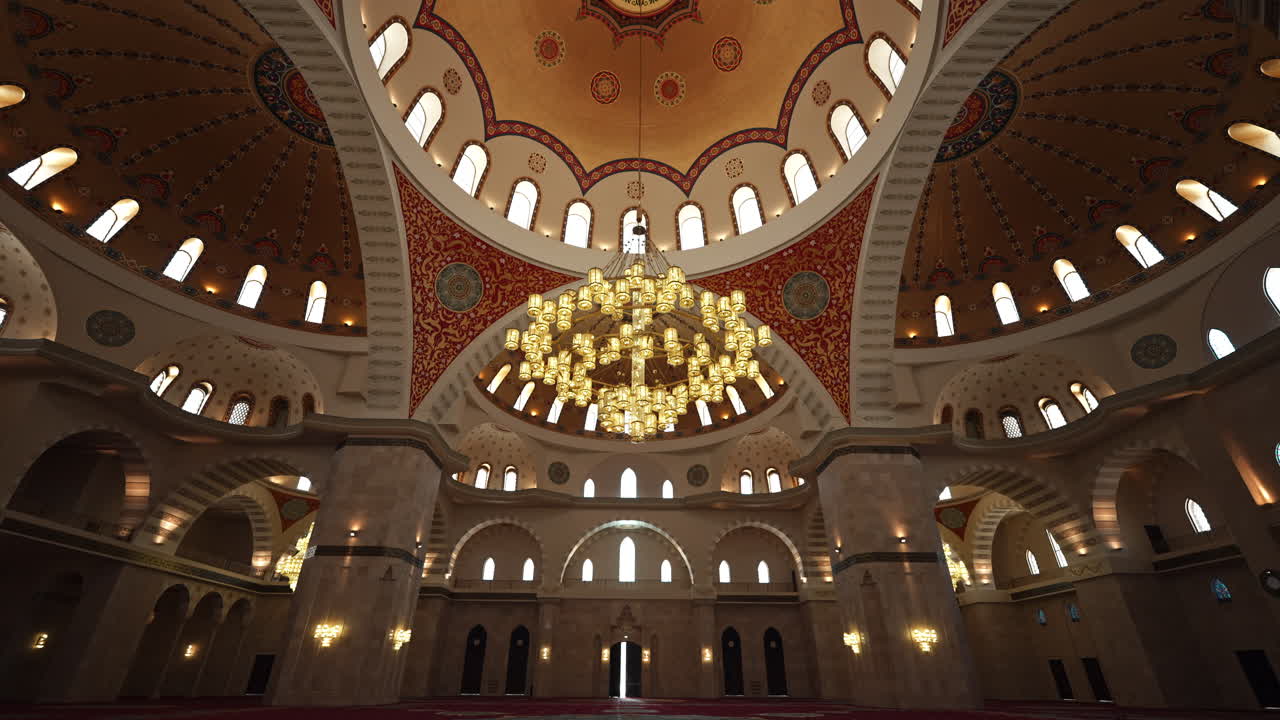 Interior of a Mosque with Ornate Dome and Chandelier