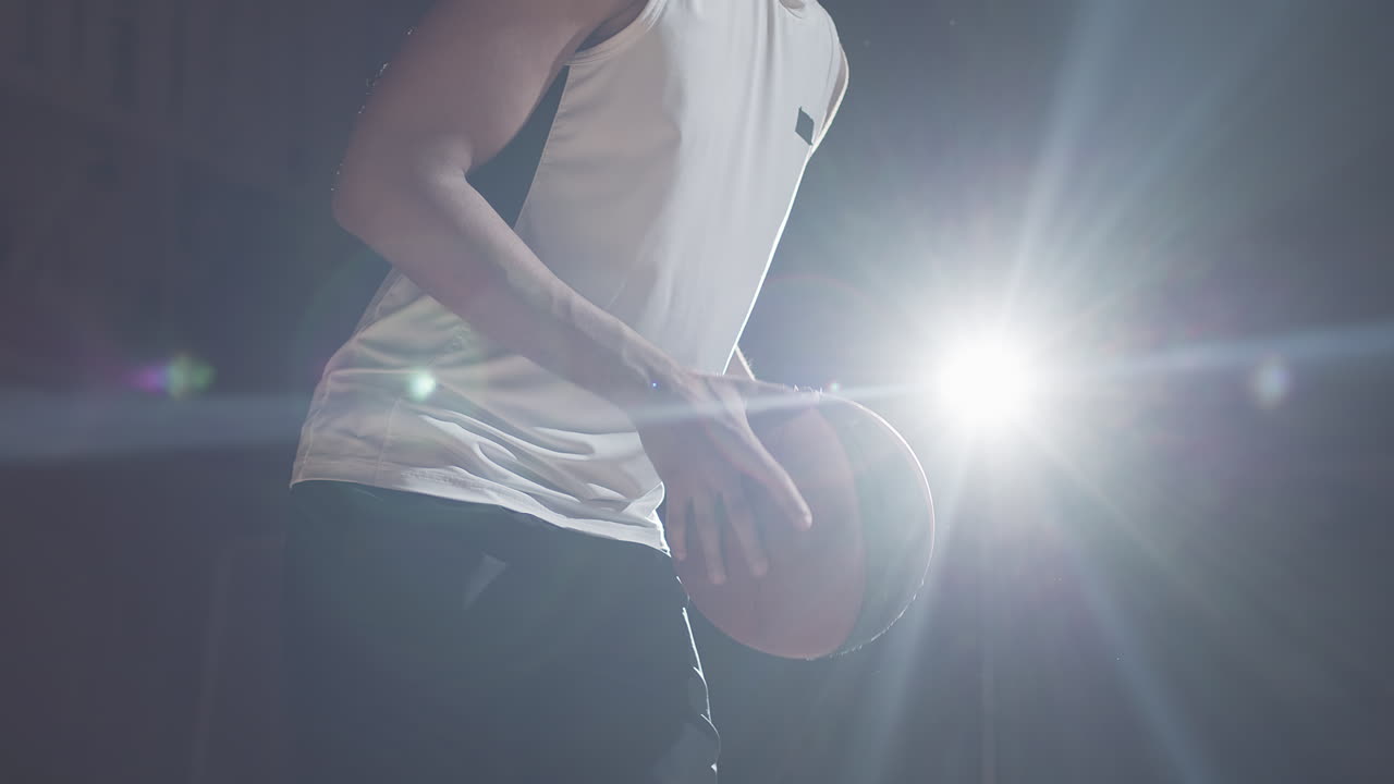 Unrecognizable Player with Basketball