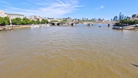 boats and bridges on the river thames