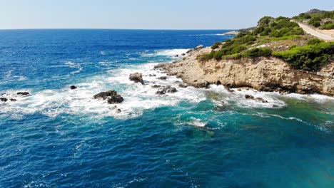 coastal road near the rocky cliff of jerusalem beach in erisos in the ionian island of kefalonia, greece