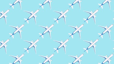Pattern with white airplane moving on blue background. Repetitive travel stop motion animation. Toy plane from above. Travel and adventure concept, flat lay style