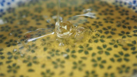 honey dripping into a bowl