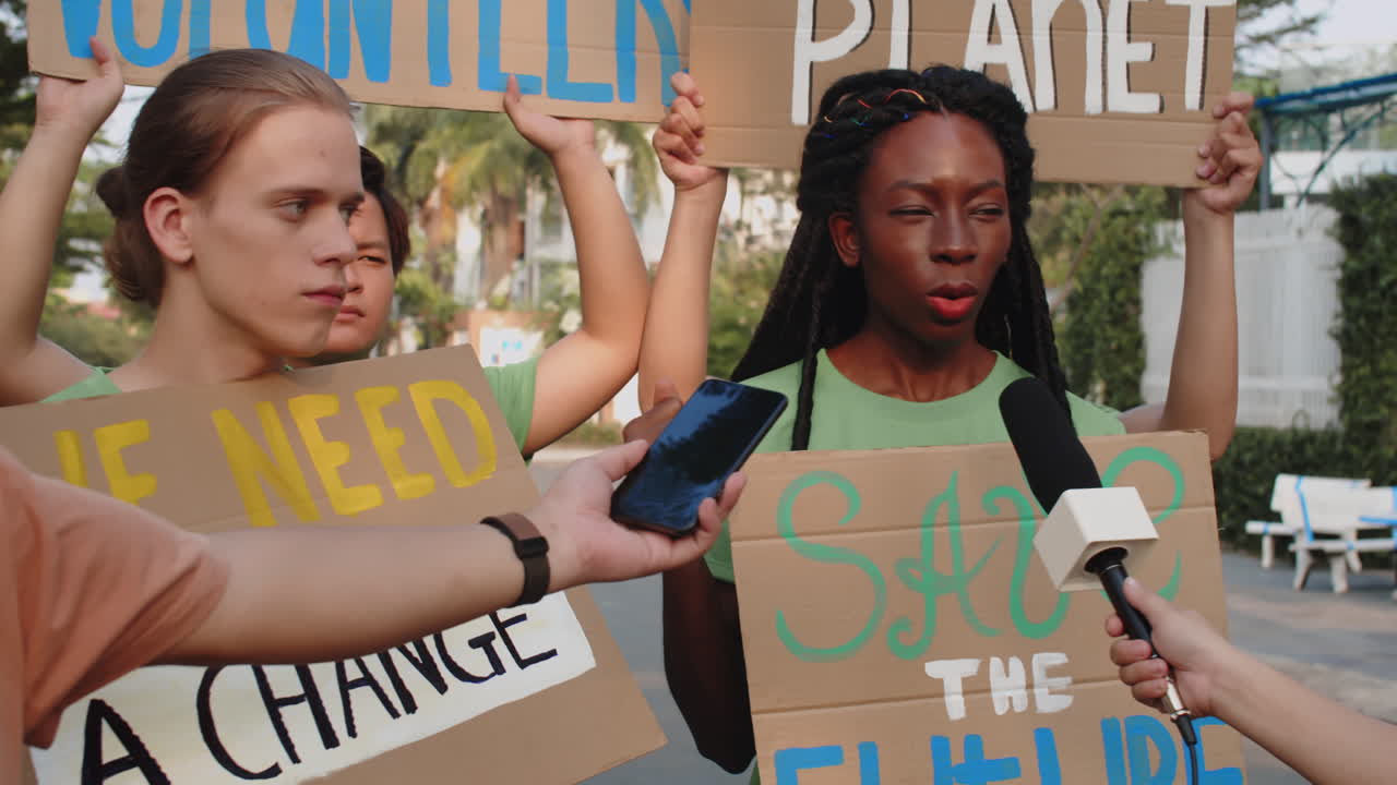 Volunteers Giving Interview to Journalists when Protesting against Air Pollution