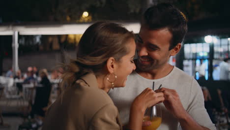 happy pair tasting alcohol having fun on date closeup. romantic partners drink