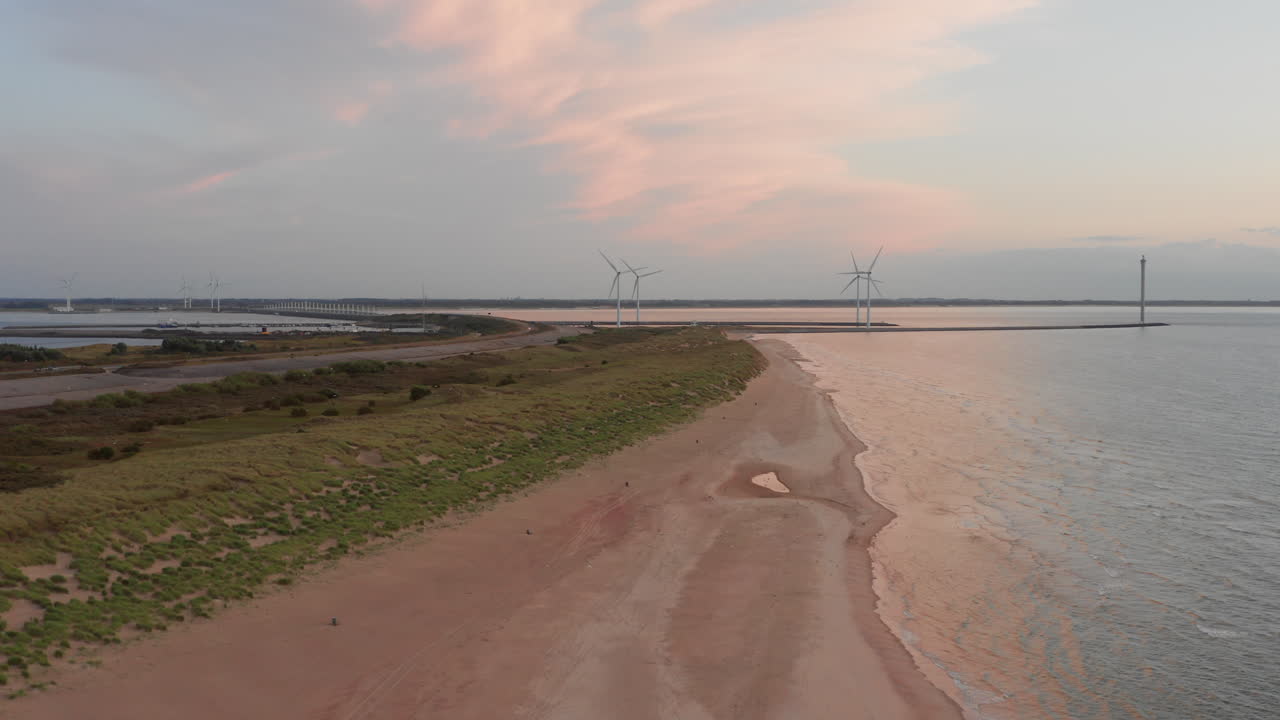 The beach of the island Neeltje Jans, the Netherlands during sunset in summer. Aerial shot