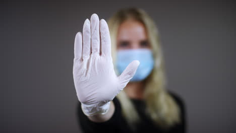 Woman-Uses-Stop-Gesture-with-Glove