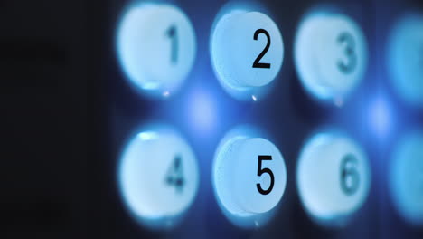 a person enters a pin code on a backlit keyboard 4