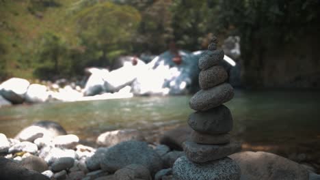 balanced rocks close-up shot in slow motion, the beautiful river on the jungle