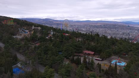 aerial view of mtatsminda park, rides at the hilltop amusement park in tbilisi, georgia.