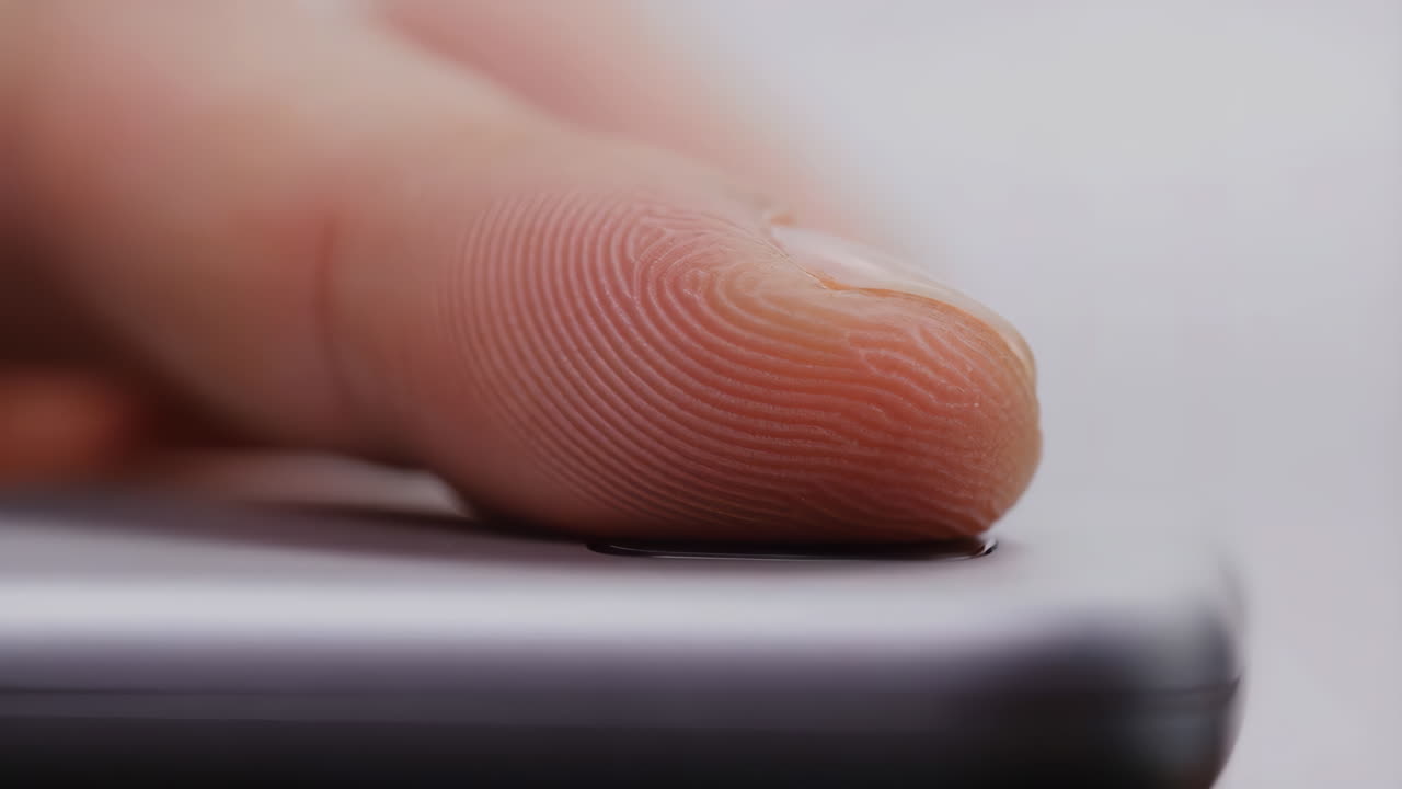 Close-up of a Fingerprint on a Biometric Sensor