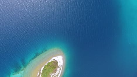 aerial drone shot top view over an island on lake khuvsgul mongolia. zoom out